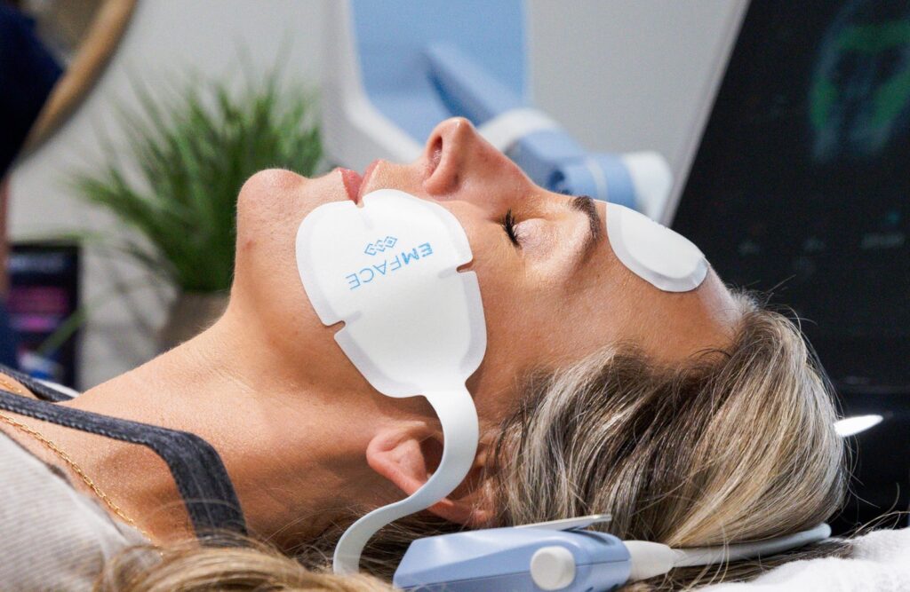 a female patient receives an EmFace treatment from a facialist near you in Sandy Springs
