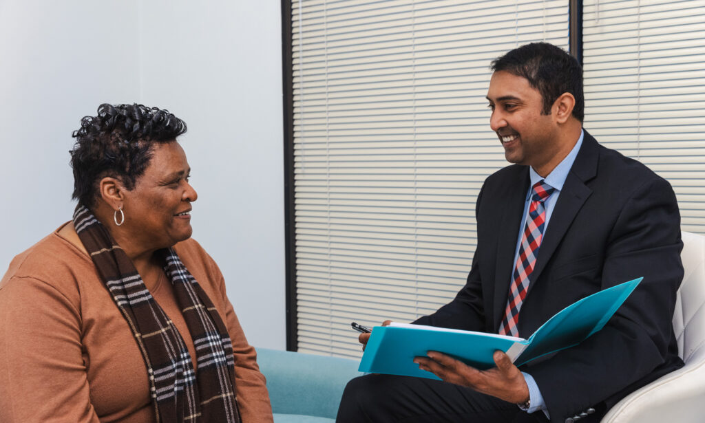 a doctor discusses why she should see a professional rather than a facialist near you in Sandy Springs during a consultation with a female patient