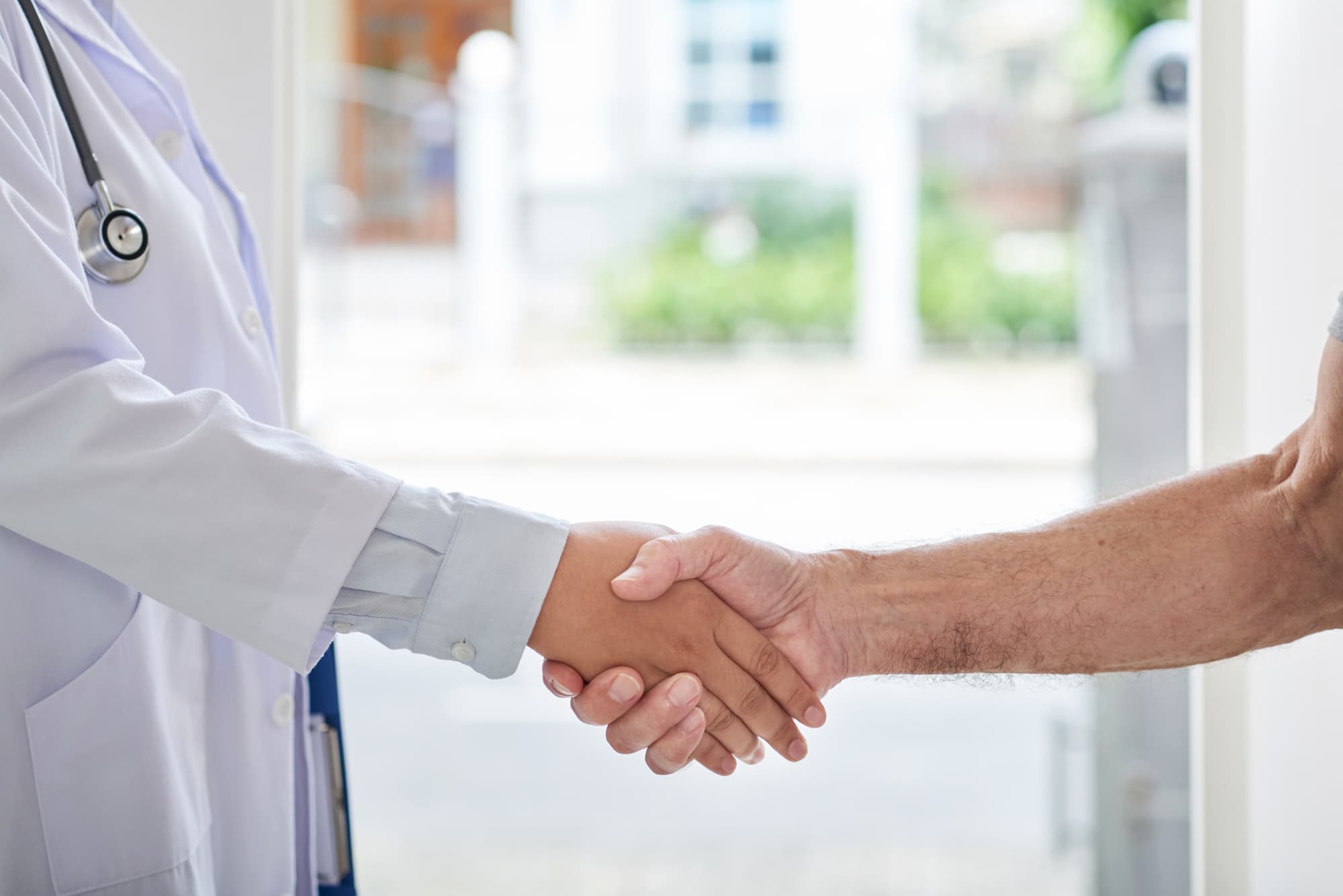 Close up of a patient and doctor shaking hands after achieving relief with Hormone Therapy Near Brookhaven